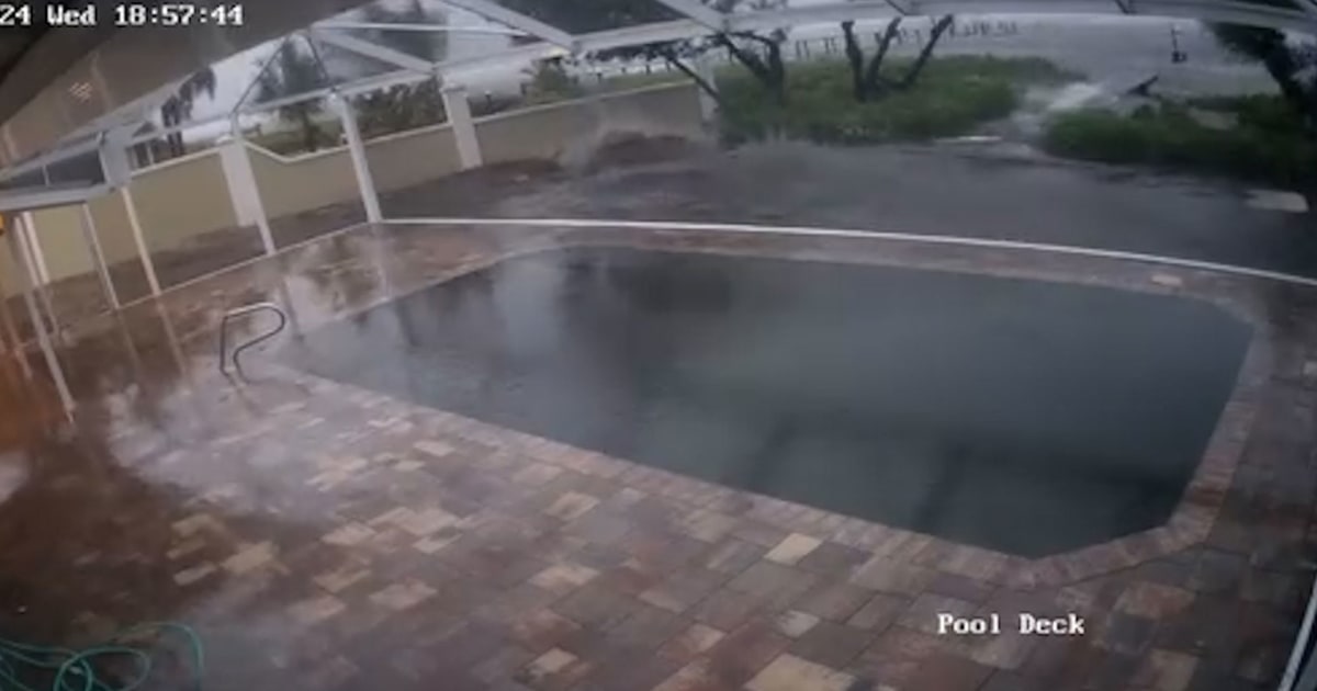 Home security cam shows in-ground pool and yard filled with Milton waters