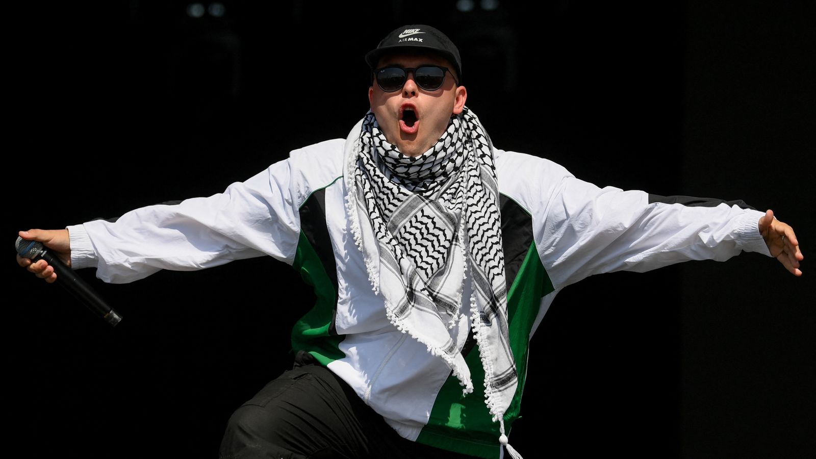 Kneecap rapper tells Glastonbury he’s a ‘free man’ after terror charge court appearance | Ents & Arts News
